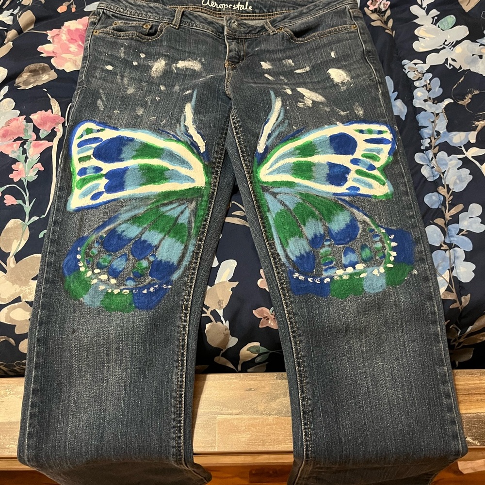 Flared painted butterfly jeans.